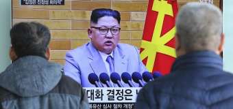 North Korea reopens hotline with South hours after Trump button boast