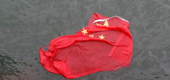 Hong Kong protestors hurl Chinese national flag into harbor